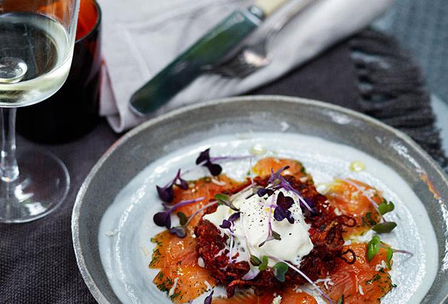 Dill-cured rainbow trout with beetroot and potato cakes and fresh horseradish