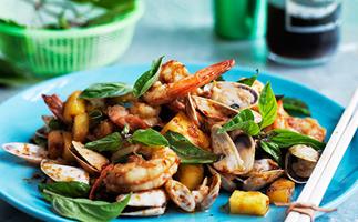 Stir-fried prawns and pipis in spicy sauce with pineapple