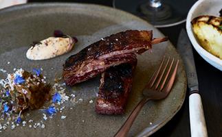Barbecued lamb ribs with smoked eggplant and yoghurt sauce