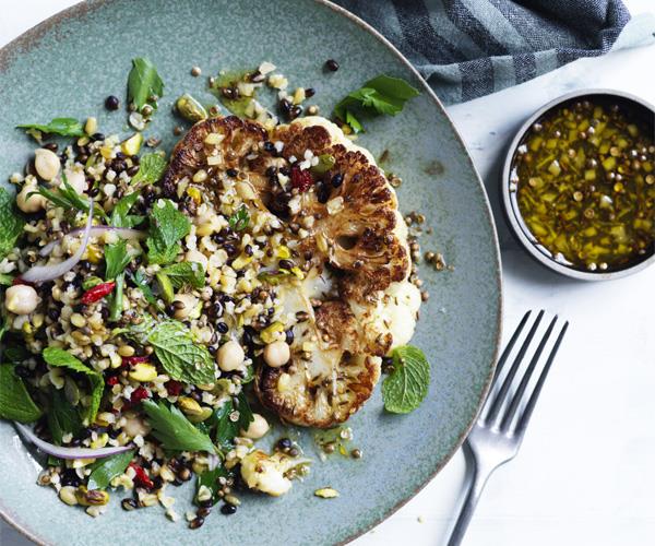 Cauliflower steaks with grain salad and spiced dressing