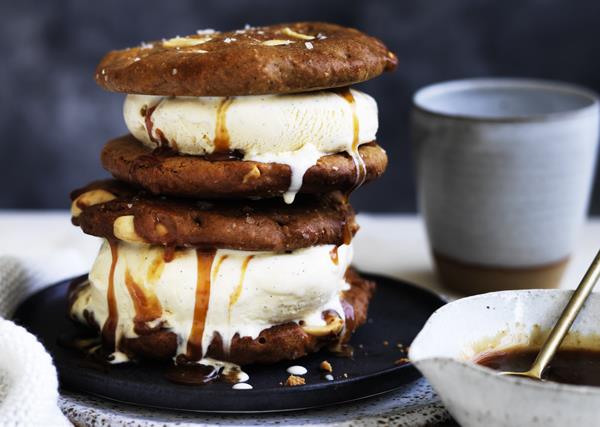 Warm peanut butter cookie ice-cream sandwiches with burnt honey