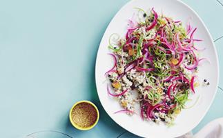 Grain salad with tahini, grilled spring onion and baharat dressing