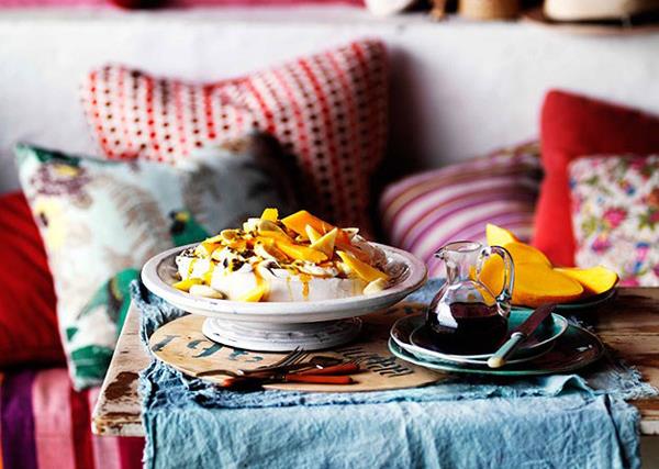 Golden pavlova with mango yoghurt and tropical fruits
