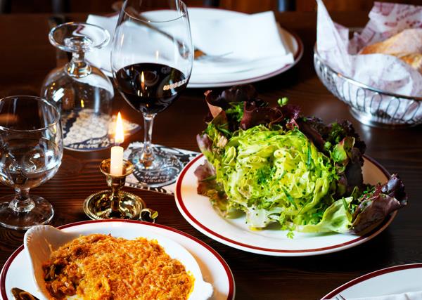 L-R Restaurant Hubert's kimchi gratin & red butter lettuce with caper and anchovy vinaigrette