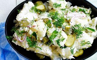 Old-school German-style crushed potato salad with dill pickles