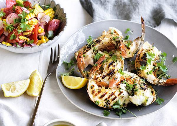 Barbecued lobster tails with lemon drawn butter and corn-radish salad