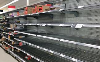 Empty supermarket shelves as a result of panic-buying triggered by COVID-19 fears.