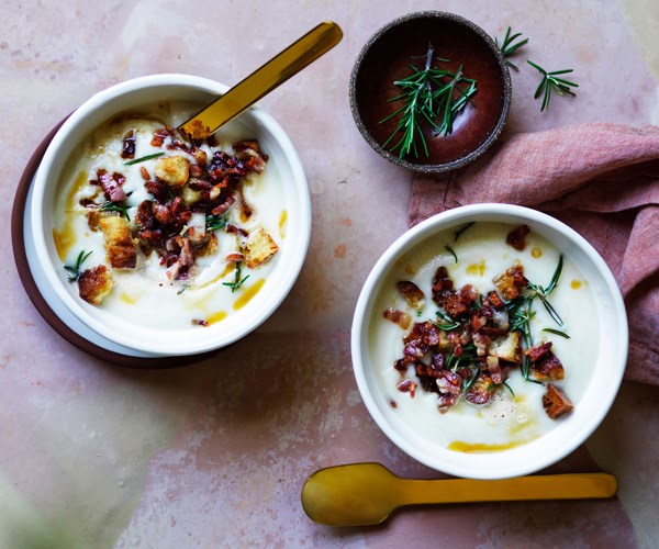 Two bowls of cauliflower and bacon soup