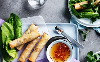 Vietnamese spring rolls with mustard leaves and herbs