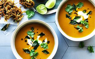 Spiced pumpkin soup with onion bhajis and curry leaves