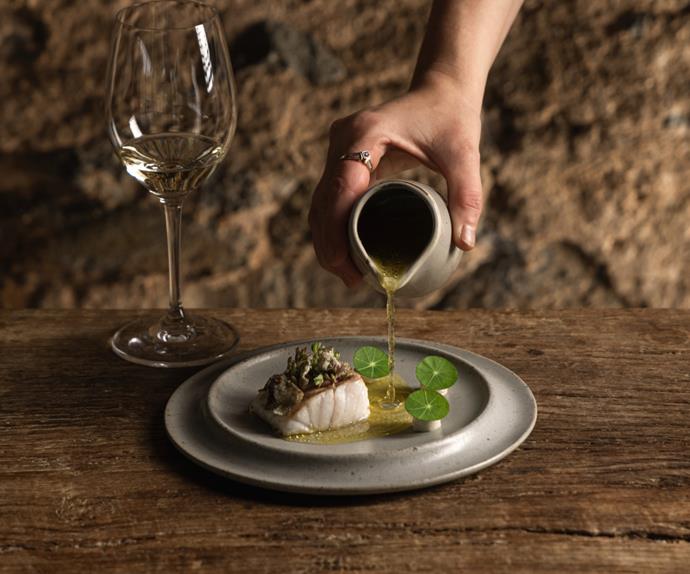 Hentley Farm restaurant in Seppeltsfield, photo of fish dish with liquid being poured onto plate