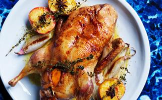 Spiced roast duck with peaches and oranges