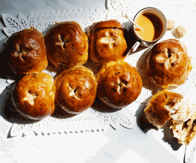 Eight savoury buns together with a saucer of syrup. 