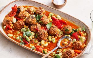 Ceramic platter with meatballs, tomato sauce and beans