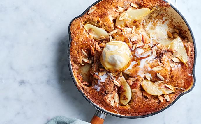 flat-lay photo of pear, Spiced pear, buttermilk and almond cake in a skillet