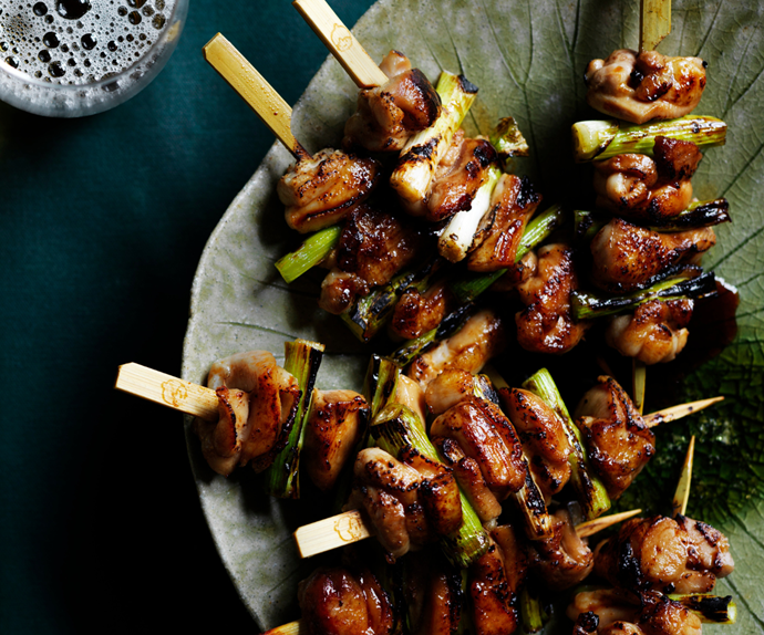 Plate of chicken and spring onion skewers
