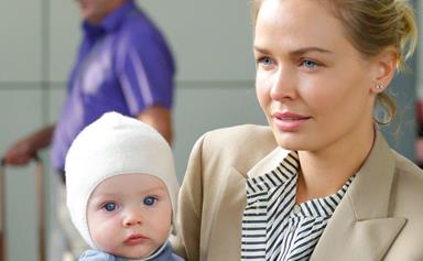 World, meet Racer! Lara Bingle touches down in Sydney with her son