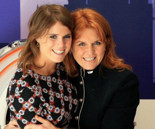 We love this snap of Eugenie and her mum Fergie visiting the Teenage Cancer Trust in 2017. The princess, just like her mother, is known for her passionate support of a range of organisations and causes close to her heart. Notable charities include the Teenage Cancer Trust and Children in Crisis. In 2012 she became patron for the Royal National Orthopaedic Hospital's Redevelopment Appeal. The hospital also where she underwent surgery as a child to correct her scoliosis. This was the princess' first patronage. *(Image: Getty)*
