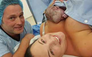 Mother, father and baby immediately after caesarean delivery