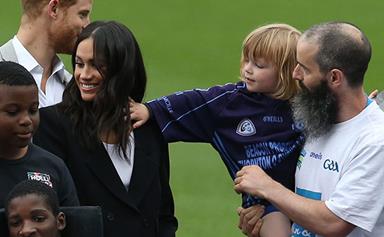 A cheeky toddler pulls Meghan Markle's hair and Prince Harry can't stop laughing