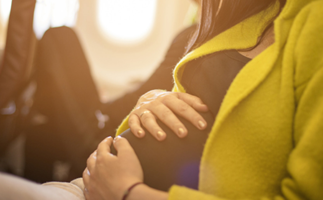 Everything you need to know about flying while pregnant and what to do once you get to your destination