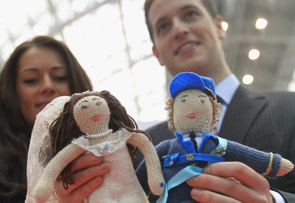 We're not sure if these dolls will be a hit anywhere else, but they were at the UK toy annual trade show in central London. Prince William and Kate Middleton look-alikes Andy Walker and Kate Bevan hold up the knitted figures of the royal couple.