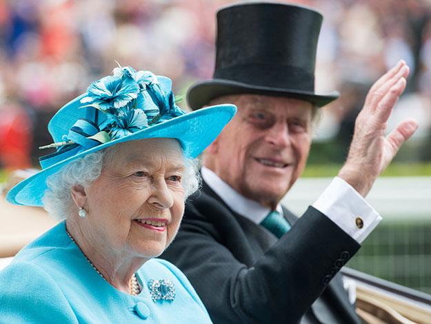 The Queen stood out in turquoise as she was driven down the course.