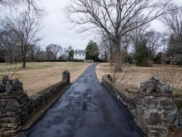The property has a long driveway.