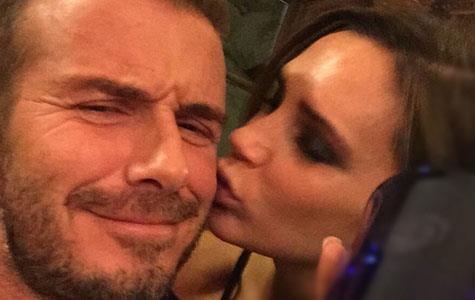 Victoria Beckham smooches David Beckham as he launches his whisky line