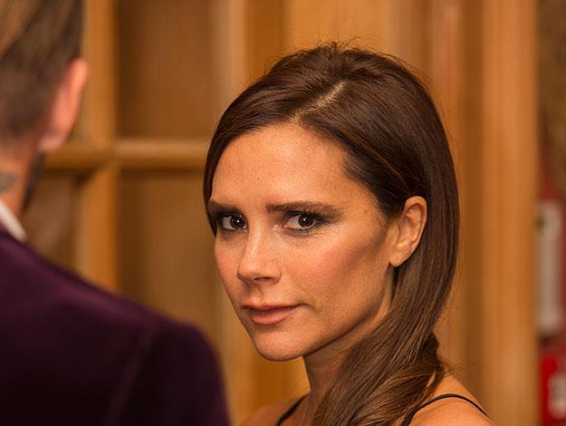 Victoria Beckham seen at the launch looking on dotingly at her husband David.