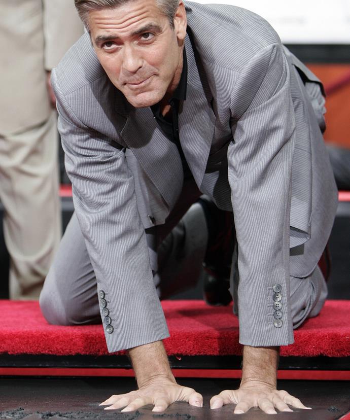 George Clooney immortalises his prints in cement in the famed forecourt of Grauman's Chinese Theatre, in celebration of the film Ocean's Thirteen.