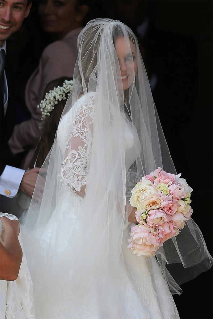 The bride wore a white lace dress, with a matching white veil by Philippa Lepley.