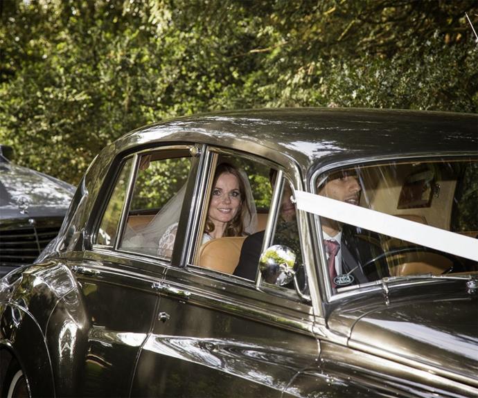 Geri and Christian (unsurprisingly) left in a flashy vintage car.