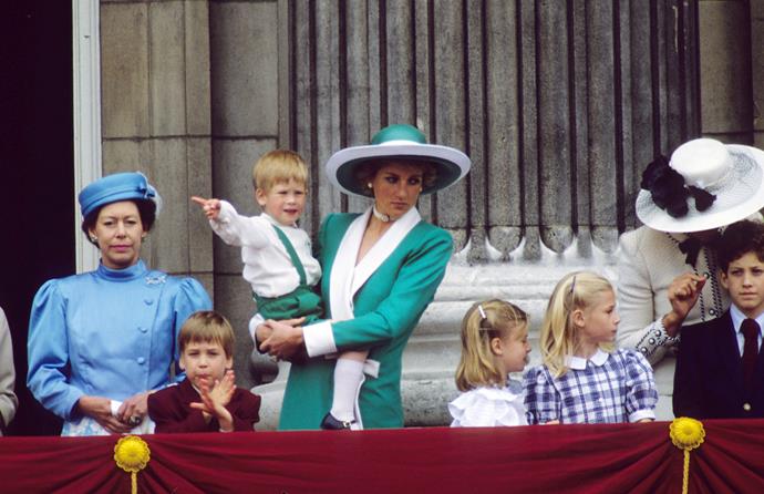 Prince William, Princess Margaret and Diana, Princess of Wales holding baby Prince Harry stand on the balcony of Buckingham Palace following Trooping the Colour on June 1, 1988 in London.