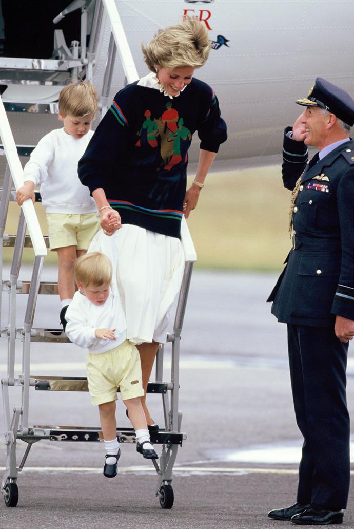 Diana, Princess of Wales, and her young sons Prince William and Prince Harry arrive at Aberdeen Airport in 1986.