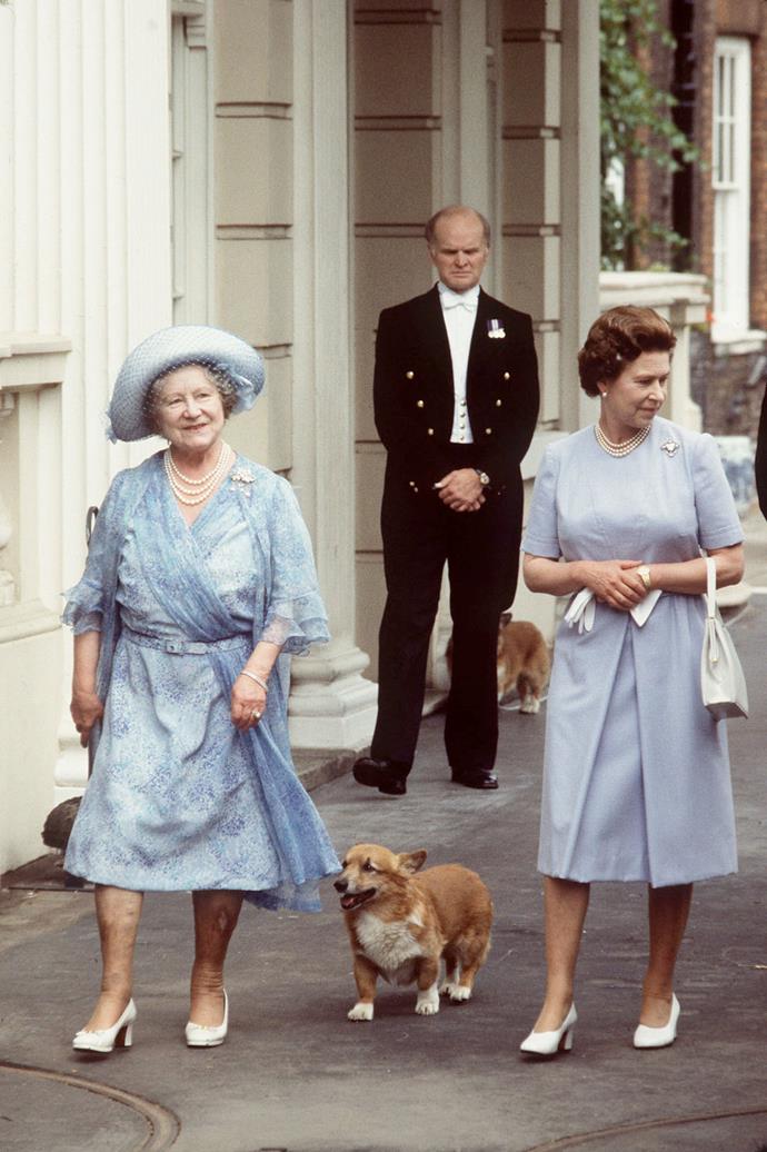 The Queen and Queen Mother walking the corgis  outside Clarence House.