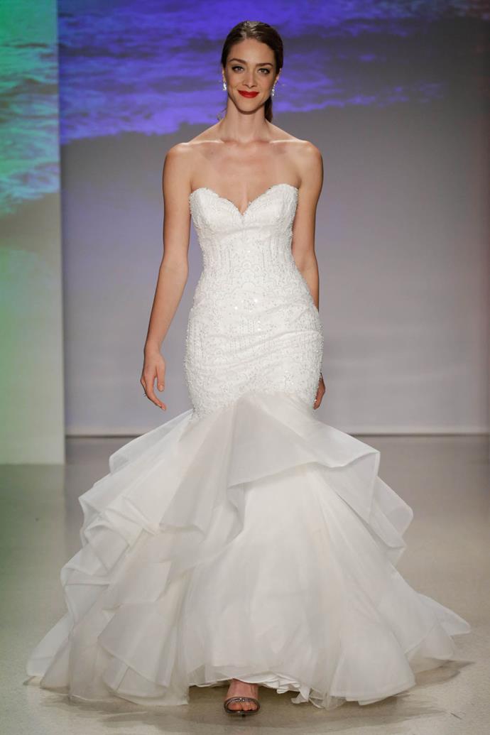 With flowing lines and undulating tulle ruffles, this gown is a true reflection of Ariel, princess of the sea.