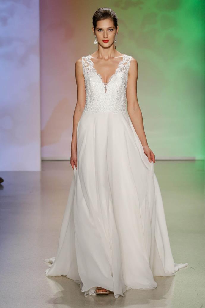 The soft and feminine chiffon skirt on this A-line wedding dress reflects the princess Aurora with its playful charm.