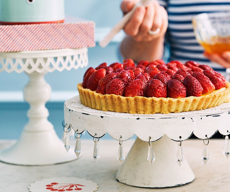Big, beautiful strawberries nestled on top of crème pâtissière in a delicious buttery flan pastry and brushed with a sweet apricot glaze is the epitome of decadent, yet simple, French baking. This [strawberry flan](https://www.womensweeklyfood.com.au/recipes/strawberry-flan-30799|target="_blank") is a must-make!