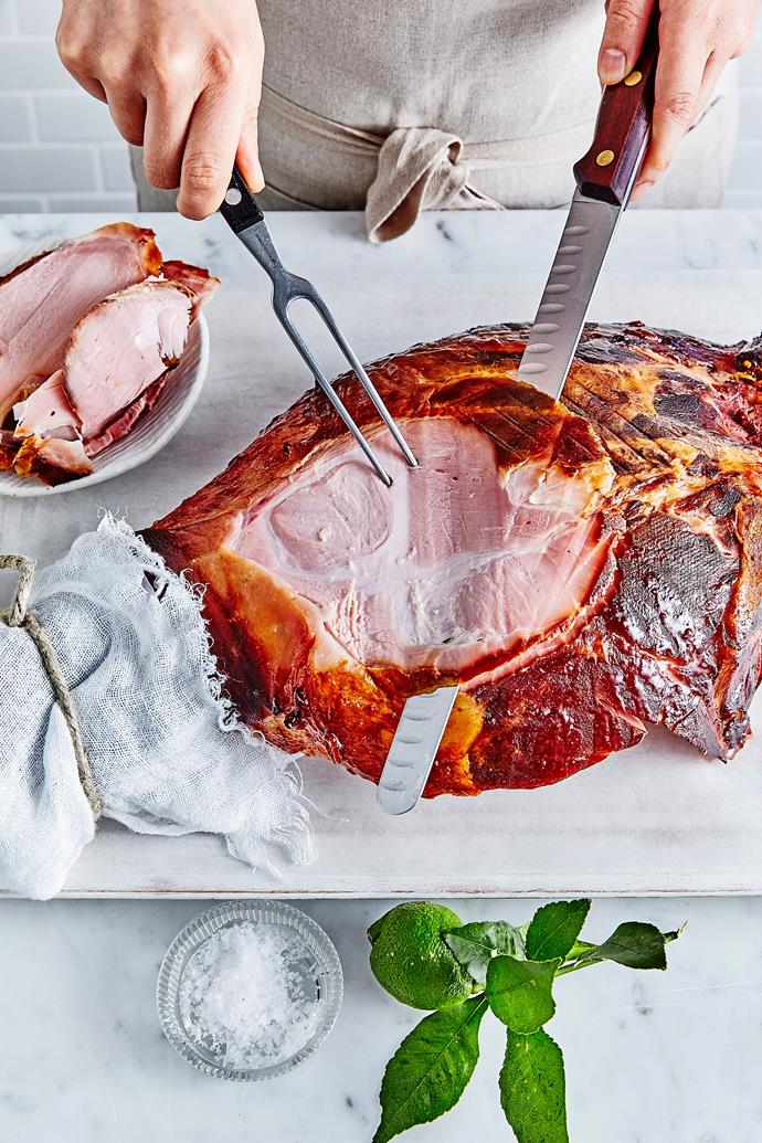 There is less meat on the underside of the ham, so carving parallel to the bone is the best way to create nice big slices.