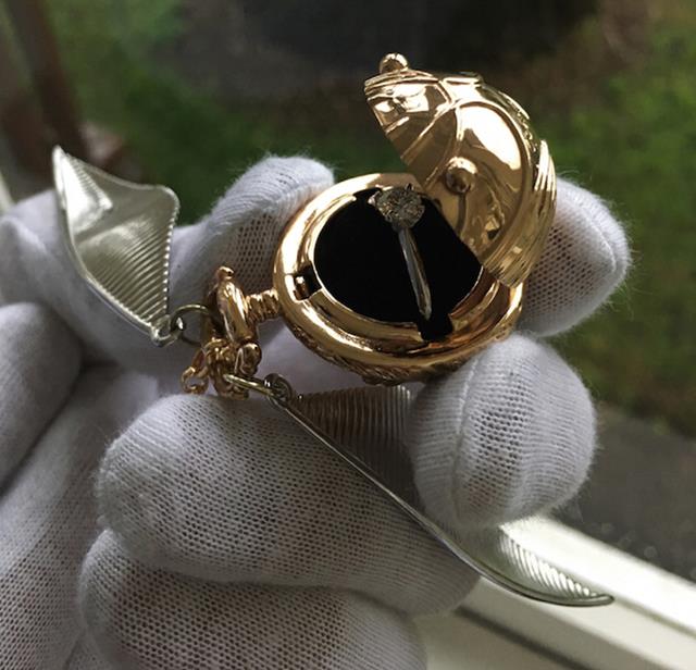A Golden Snitch engagement ring box now exists for you Harry Potter Fans