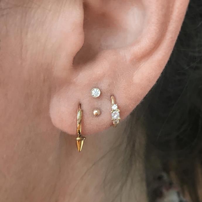 The vertical studs and mix of gold and diamonds makes for one sweet curated lobe.
<br><br>
Image: [@pennythepiercer](https://www.instagram.com/p/BZozcsGHMFW/?taken-by=maria_tash)