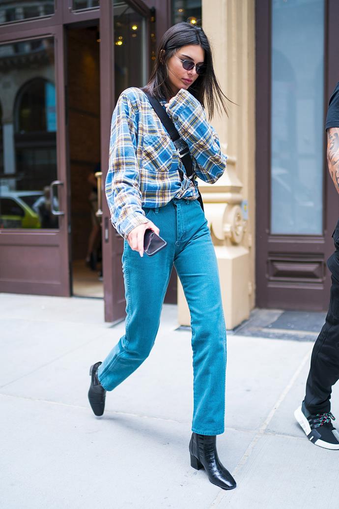 Kendall made a case for bringing back the lumberjack shirt while running errands around New York. Her style trick? Teaming with a pair of matching cerulean jeans and relaxed leather boots.