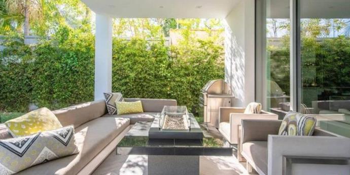 The backyard lounge area (with a glass firepit in the centre). 
<br><br>
*Image: Trulia*