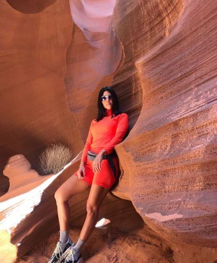 Regular cycling style icon Kourtney Kardashian is ready for the race track in this orange get-up, complete with sensible shoes and fanny pack.