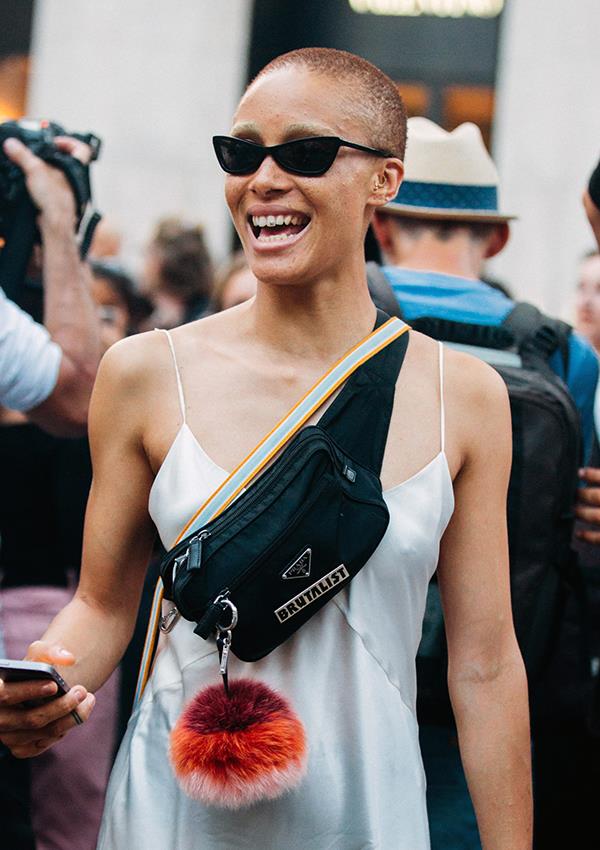 ***Prada Triangle Logo Bag: Now***
<br><br>
Prada's game-changing logo bags are officially back on-trend, courtesy of [Adwoa Aboah](https://www.elle.com.au/fashion/adwoa-aboah-tomboy-style-file-14564|target="_blank"), Kim Kardashian West, Bella Hadid, and countless other It-faces. The label also showed their iconic nylon bags on the runway for the first time at autumn/winter '18, even though they've sold them since the '90s.