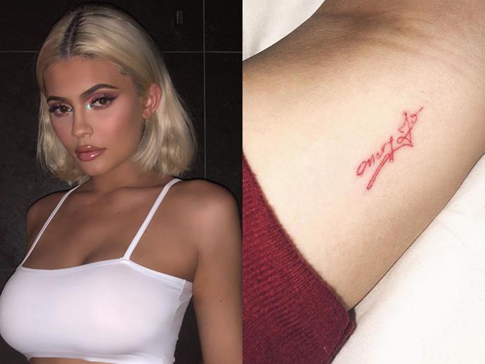 **KYLIE JENNER**
<br><br>
The makeup mogul has her grandmother's name, Mary Jo—wirtten in her grandfather's handwriting—on her inner arm.