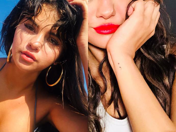 **SELENA GOMEZ**
<br><br>
Along with her *13 Reasons Why* crew, Tommy Dorfman and Alisha Boe, Gomez had a semi-colon tattooed on her wrist. The punctuation mark has become a symbol for the battle with depression, and also happens to be the same tattoo that *13RW* character, Clay Jensen, got tattooed on his wrist in the wake of protagonist, Hannah Baker's, death.
