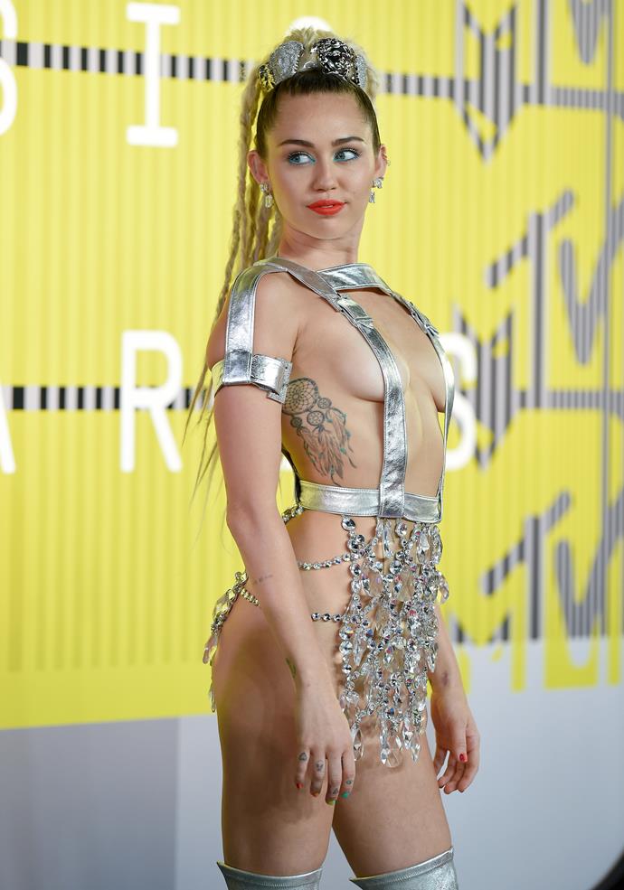 **Miley Cyrus**
<br><br>
Most of Miley Cyrus' vast collection are pretty small, but this dream-catcher on her rib cage is certainly sizeable.