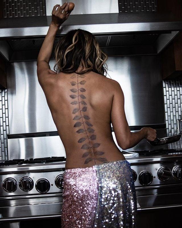 **Halle Berry**
<br><br>
In a glamorous photo shoot in her kitchen, Halle Berry recently showed off the branch of leaves that travels down her back.
